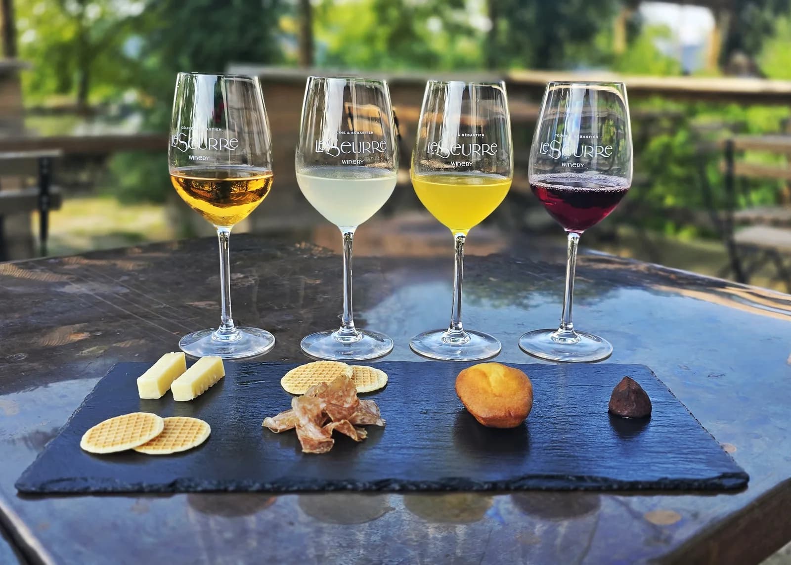Four juice and food pairings served on a slate board